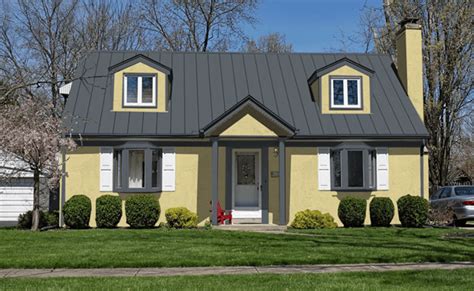 yellow house gray metal roof|pictures of houses painted yellow.